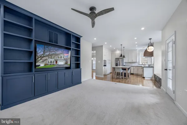 a view of room with window and ceiling fan