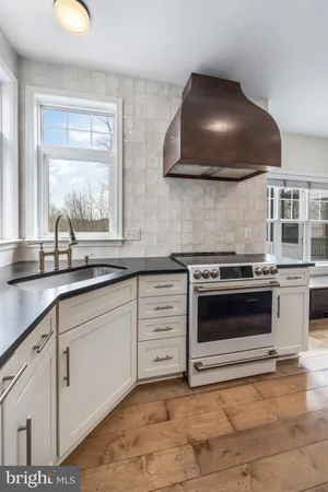 a view of a house with a large window and wooden floor