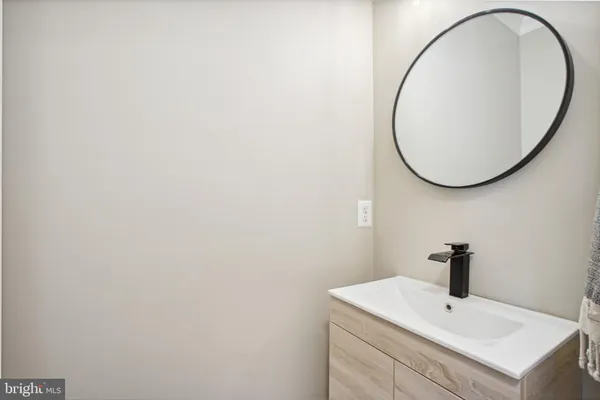 a view of a balcony with two chairs and a table