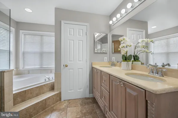 a view of swimming pool with lawn chairs and a yard