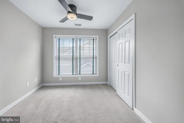 a view of a house with pool and chairs