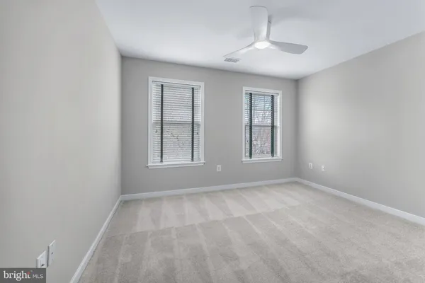 a view of a lake with a house in the background