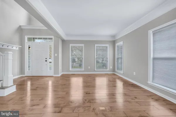 a living room with furniture fireplace and a large window