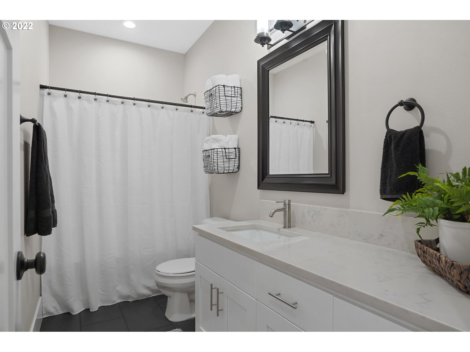 11974 South Mt Hope Road Molalla, OR 97038 - Photo 22 of 30 a bathroom with a toilet sink and mirror