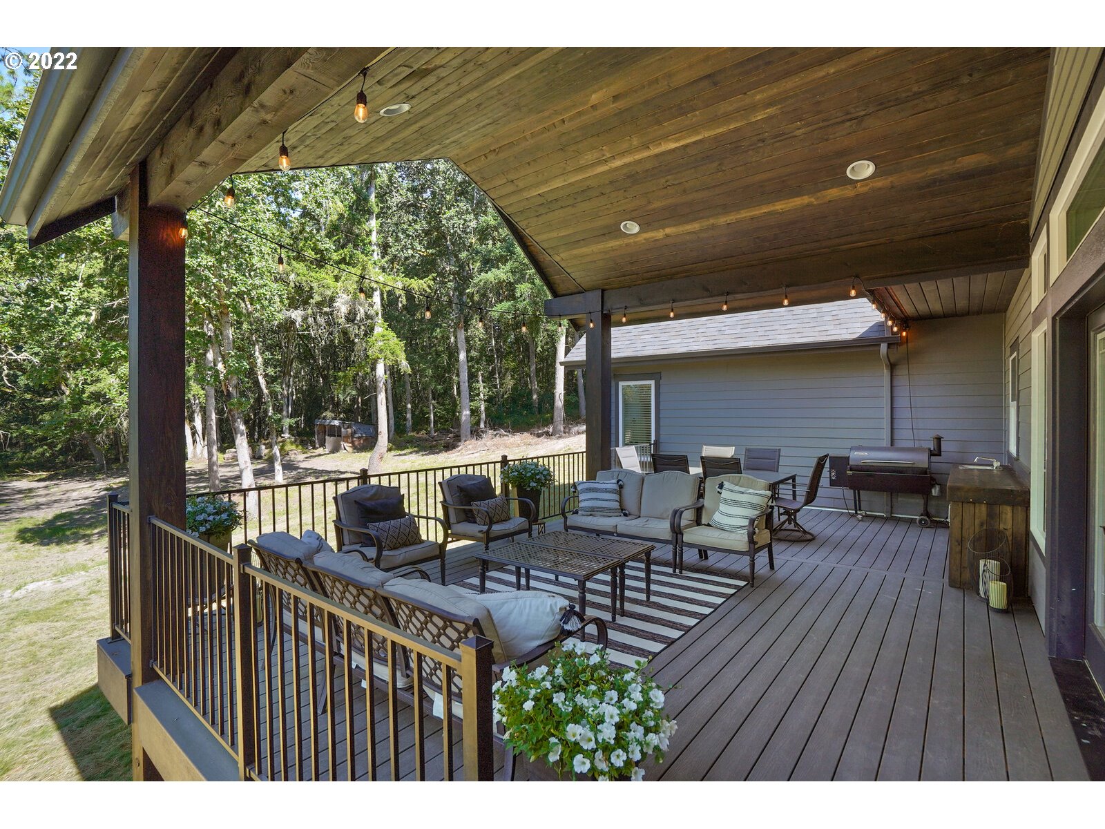 11974 South Mt Hope Road Molalla, OR 97038 - Photo 27 of 30 a view of a patio with table and chairs with wooden floor