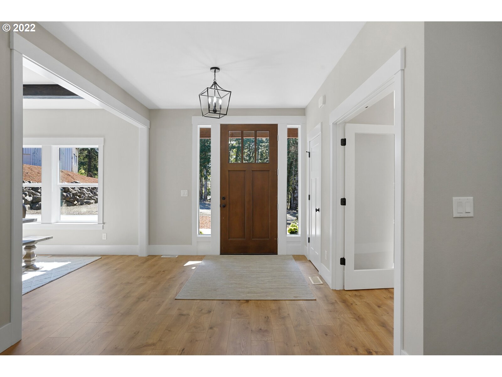 11974 South Mt Hope Road Molalla, OR 97038 - Photo 6 of 30 a view of a hallway with wooden floor and a living room