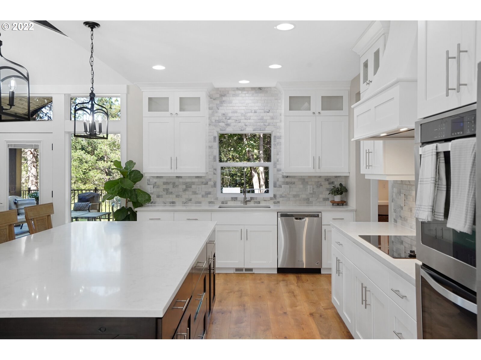 11974 South Mt Hope Road Molalla, OR 97038 - Photo 8 of 30 a kitchen with white cabinets and stainless steel appliances