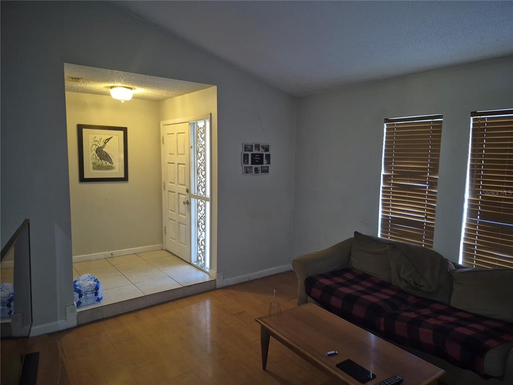 13710 Whitby Road Hudson, FL 34667 - Photo 4 of 21 a living room with furniture and a window