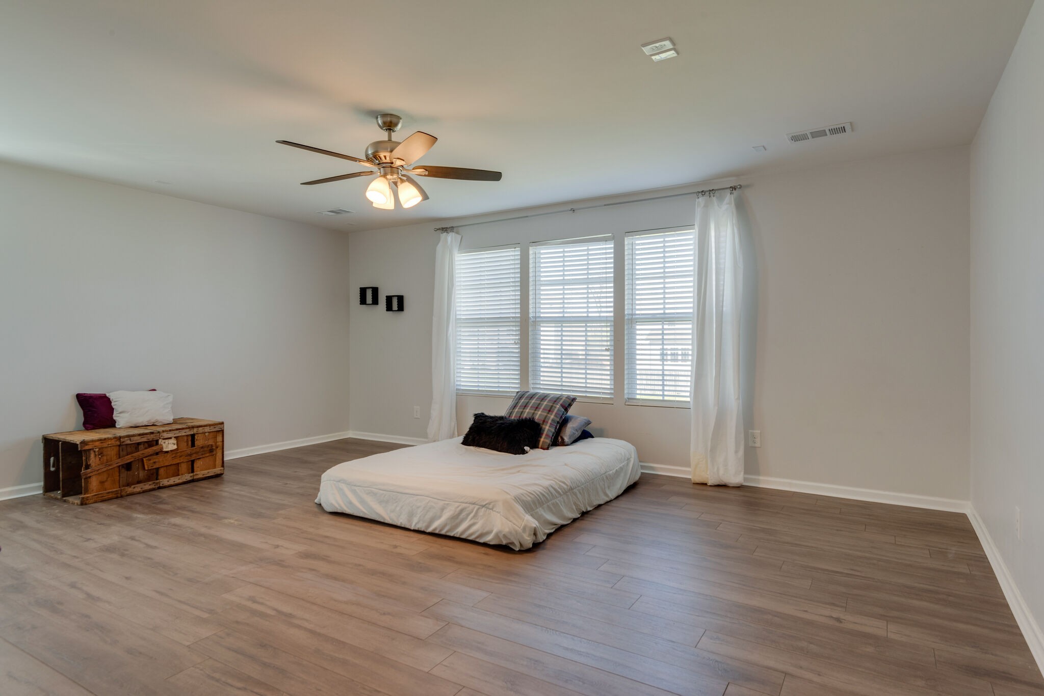 1050 Countess Lane Spring Hill, TN 37174 - Photo 16 of 22 a bedroom with a bed and wooden floor