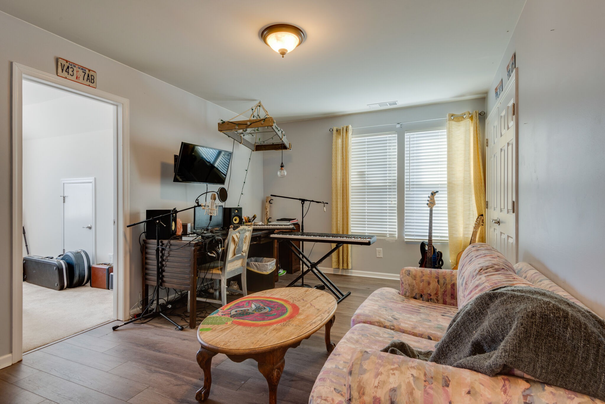 1050 Countess Lane Spring Hill, TN 37174 - Photo 17 of 22 a living room with furniture and a flat screen tv