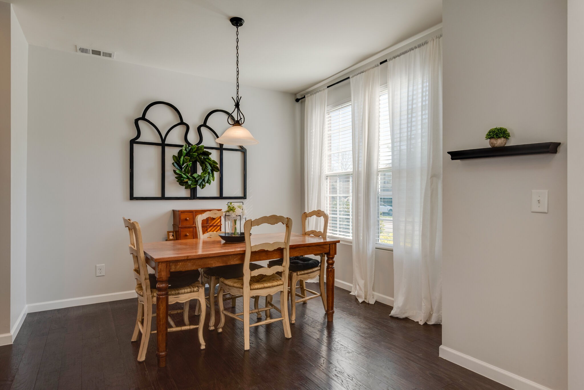 1050 Countess Lane Spring Hill, TN 37174 - Photo 4 of 22 a view of a dining room with furniture window and wooden floor