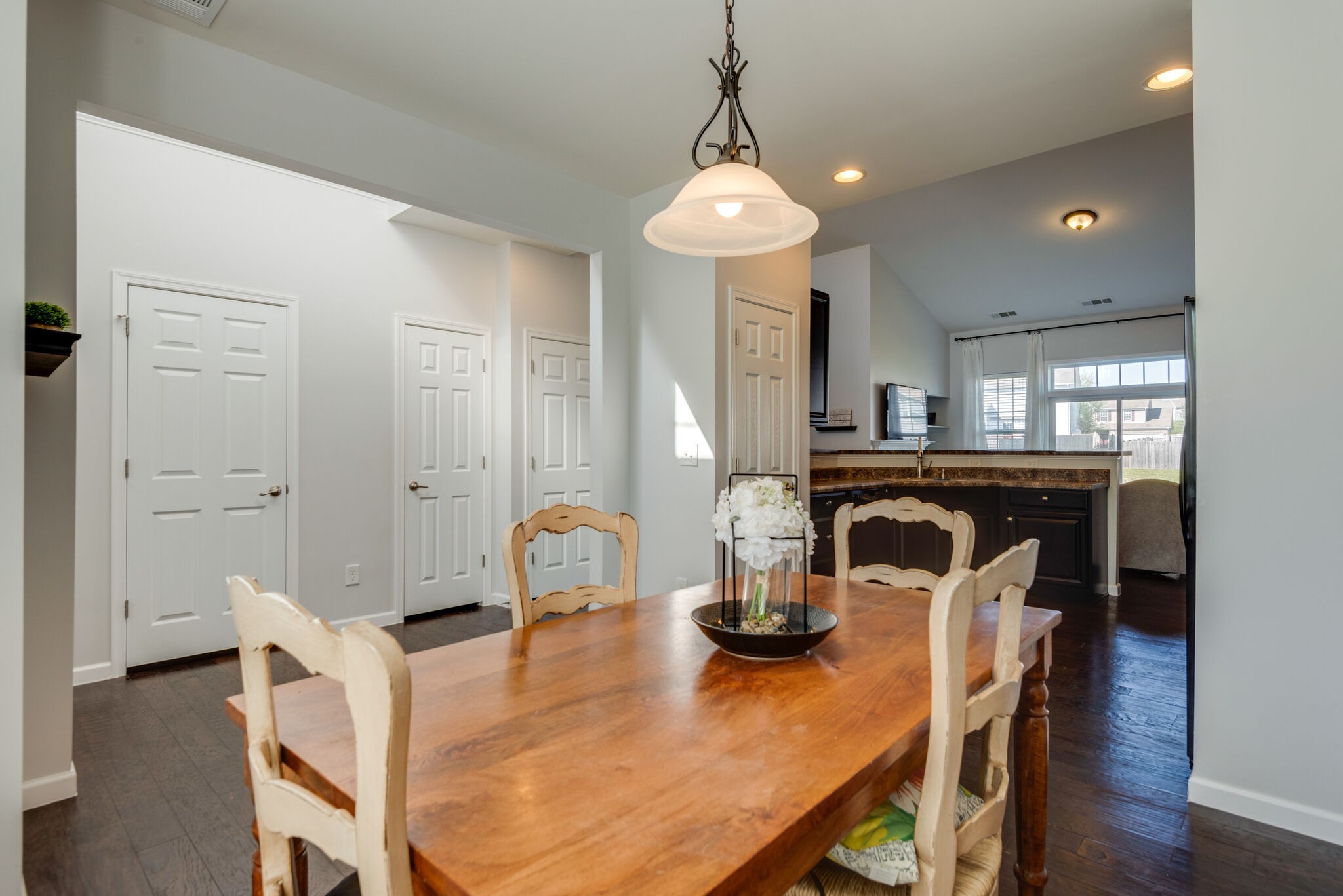 1050 Countess Lane Spring Hill, TN 37174 - Photo 5 of 22 a view of a dining room with furniture and wooden floor