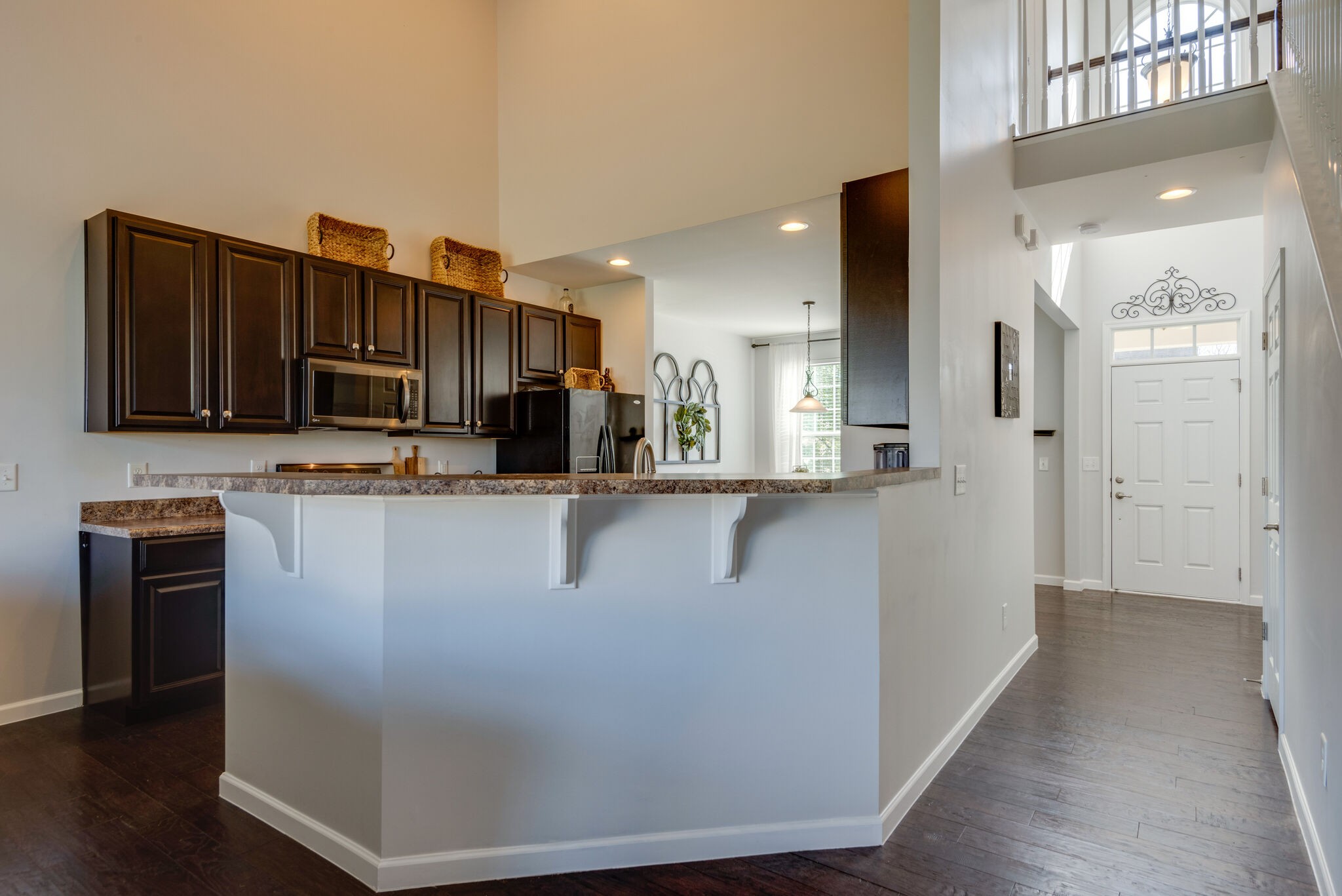 1050 Countess Lane Spring Hill, TN 37174 - Photo 9 of 22 a view of a kitchen with stainless steel appliances granite countertop a refrigerator and a stove top oven