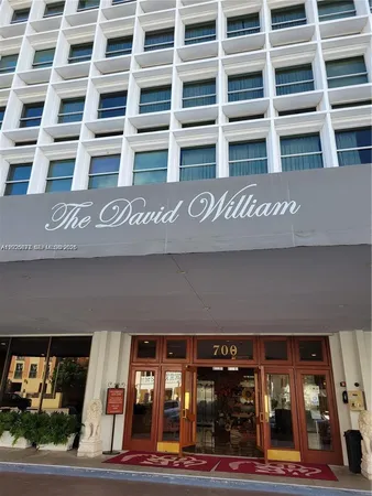 a front view of building with parking