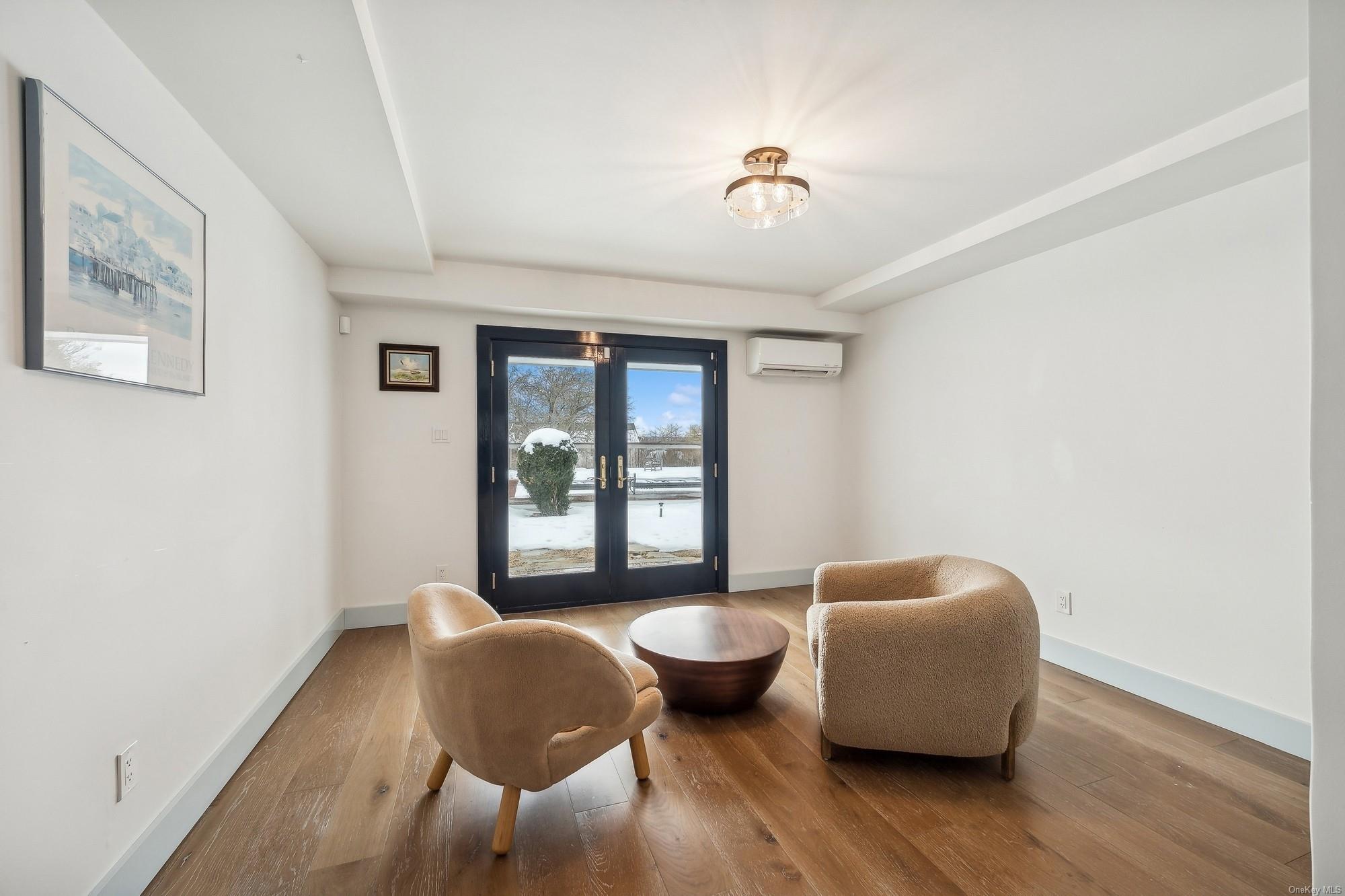 8 Big Reed Path Montauk, NY 11954 - Photo 11 of 39 a living room with furniture and a window