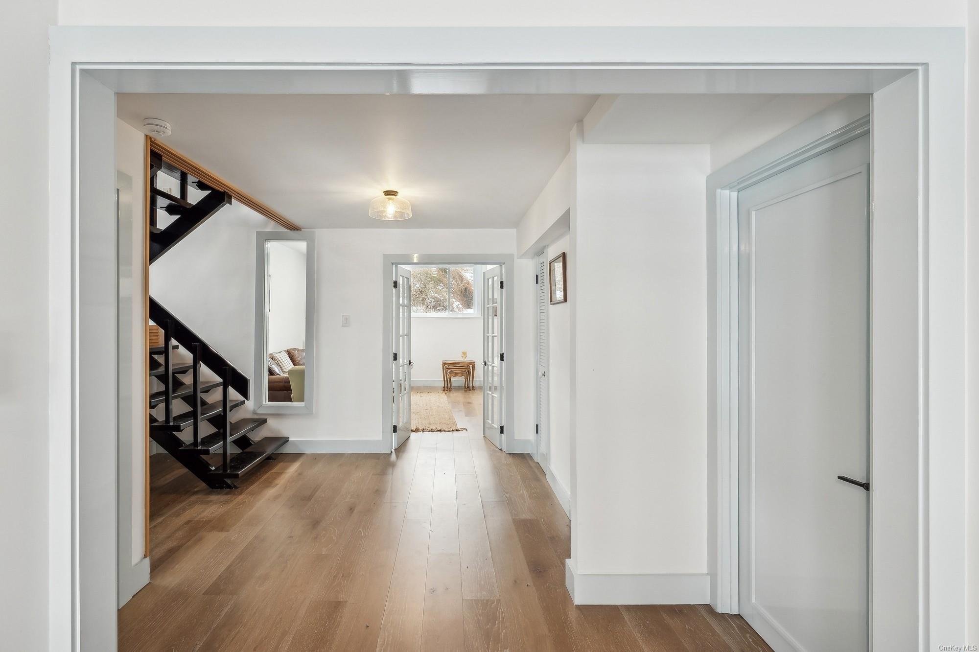 8 Big Reed Path Montauk, NY 11954 - Photo 18 of 39 a view of entryway with wooden floor