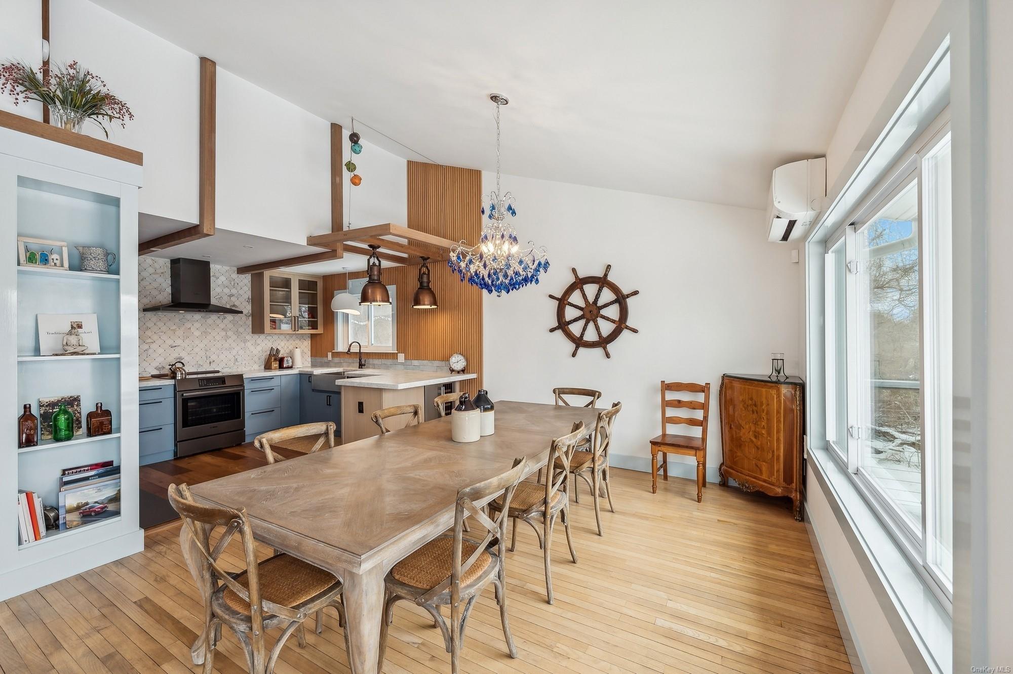 8 Big Reed Path Montauk, NY 11954 - Photo 20 of 39 a view of a dining room with furniture and wooden floor