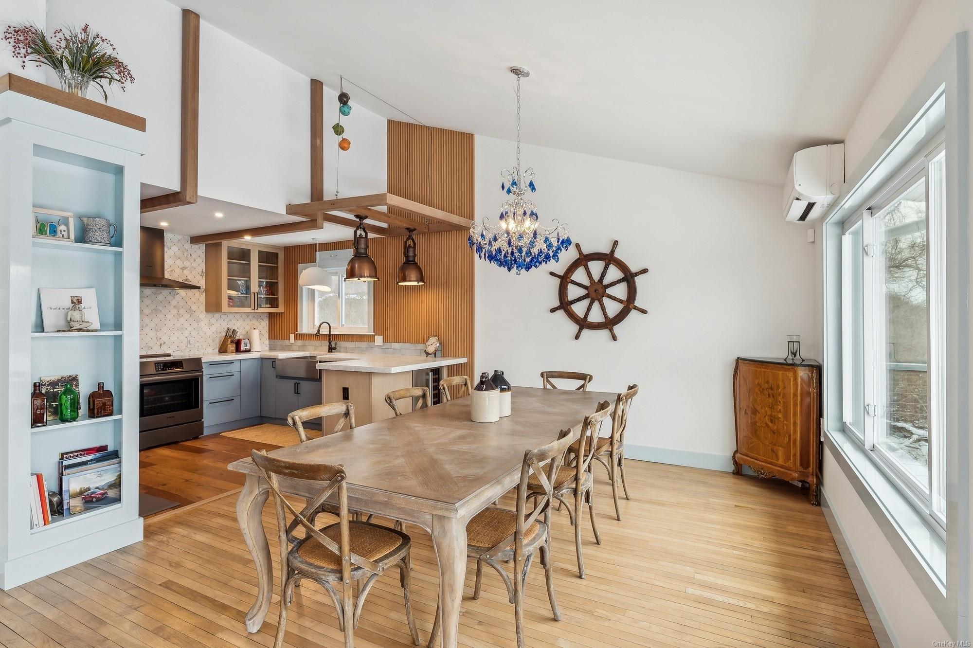 8 Big Reed Path Montauk, NY 11954 - Photo 26 of 39 a view of a dining room with furniture window and wooden floor