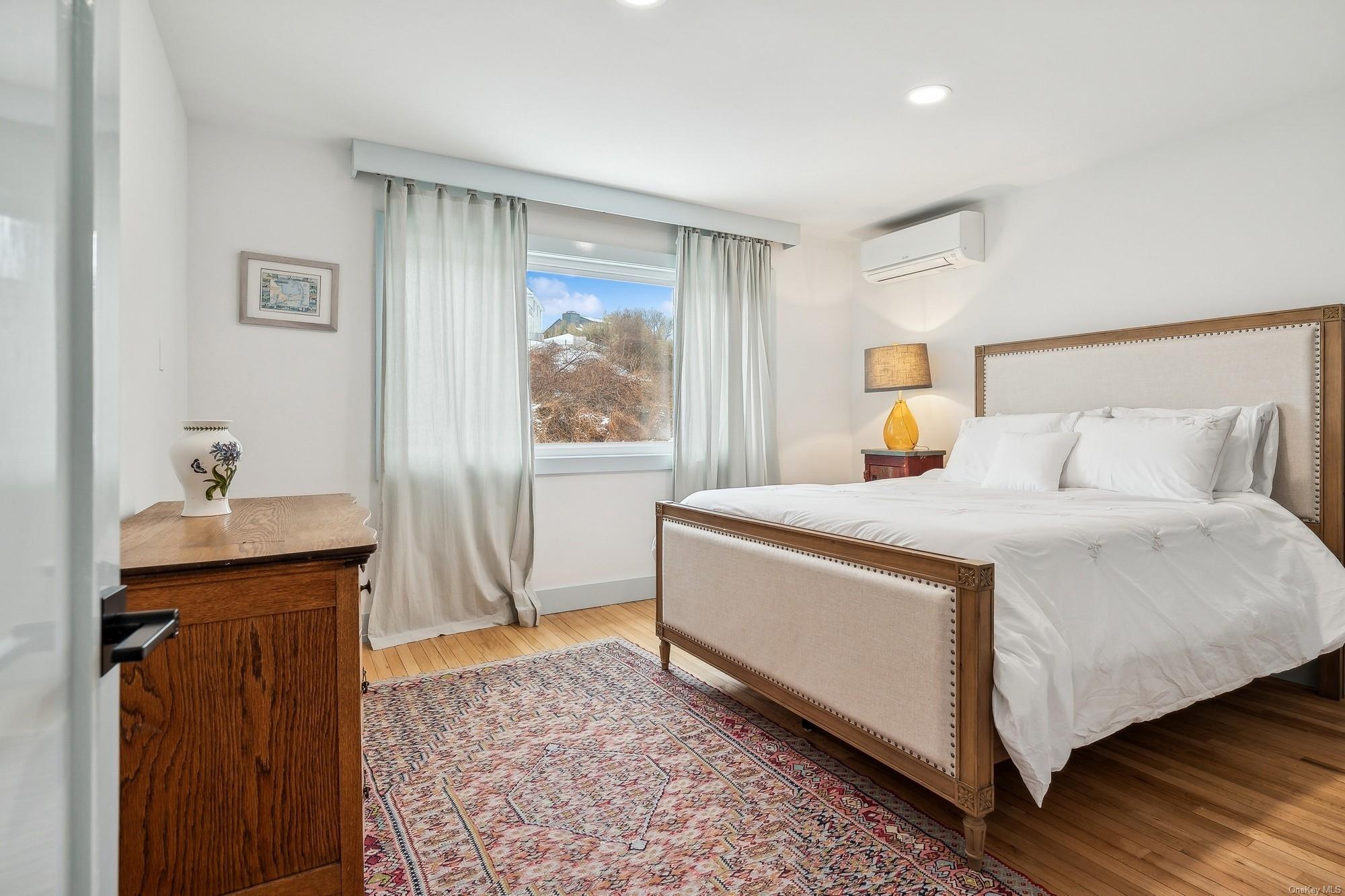 8 Big Reed Path Montauk, NY 11954 - Photo 28 of 39 a bedroom with a bed and a window