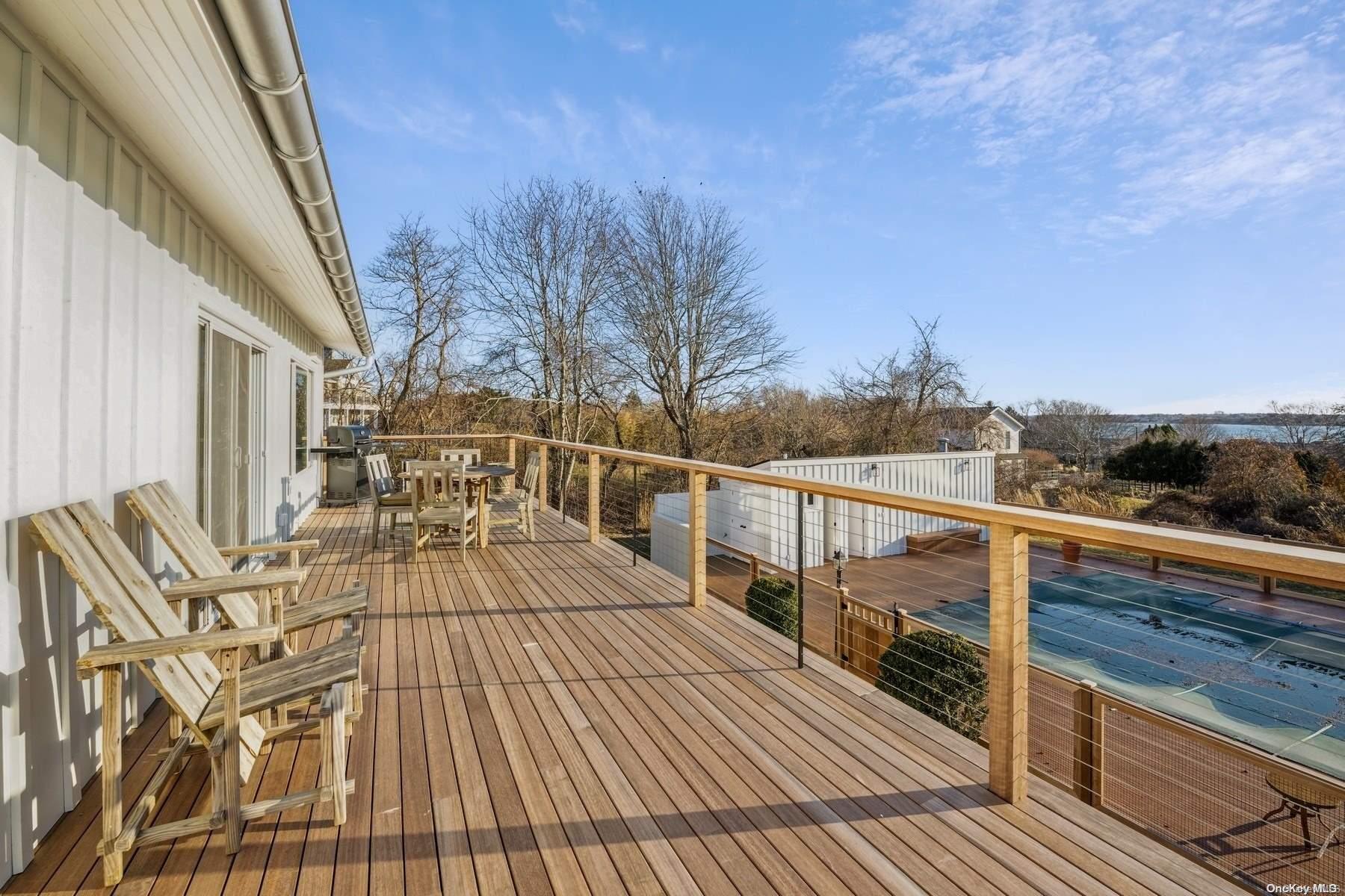 8 Big Reed Path Montauk, NY 11954 - Photo 3 of 39 a view of balcony with wooden floor and seating space