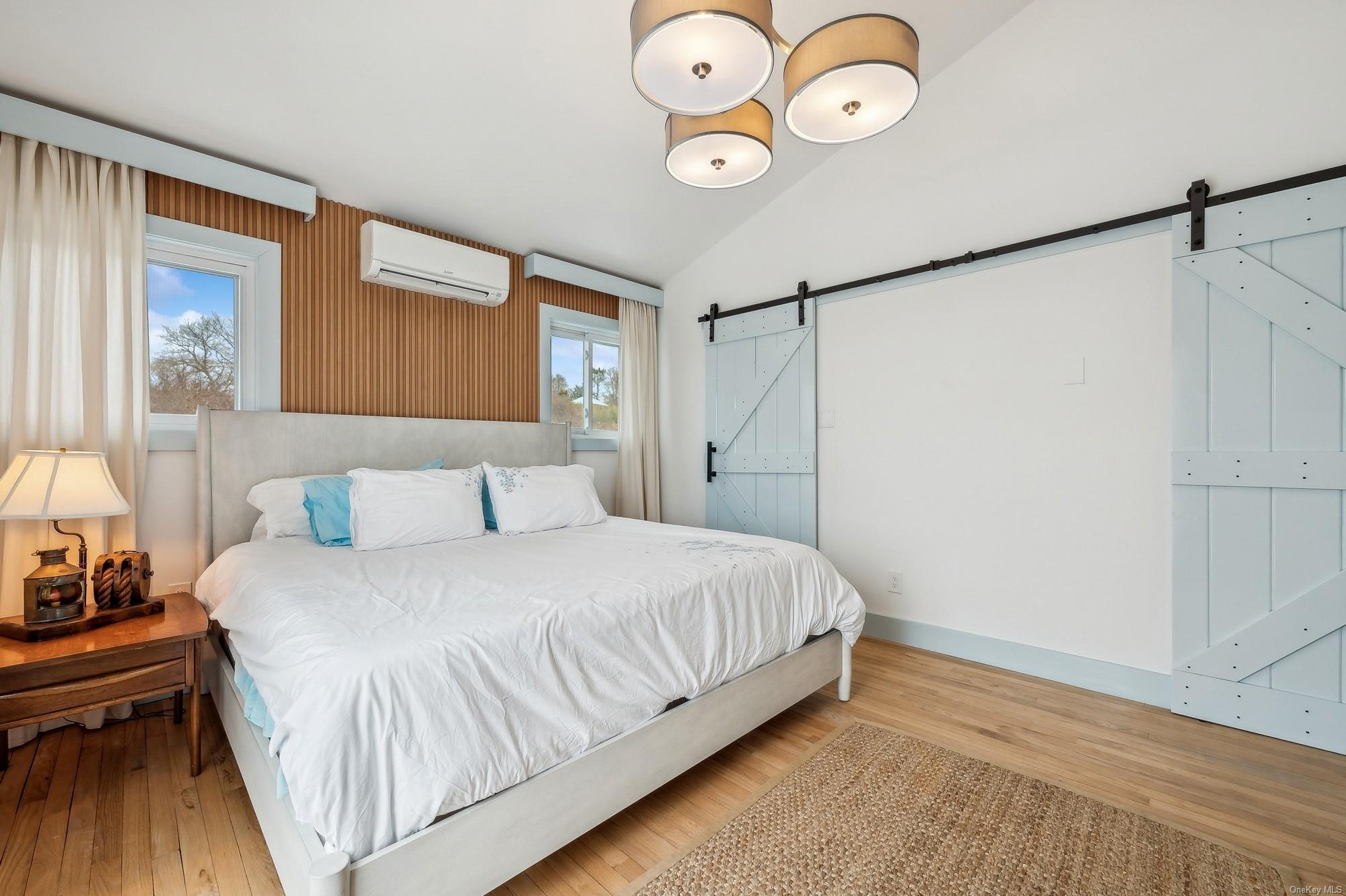 8 Big Reed Path Montauk, NY 11954 - Photo 34 of 39 a bedroom with a bed and a window