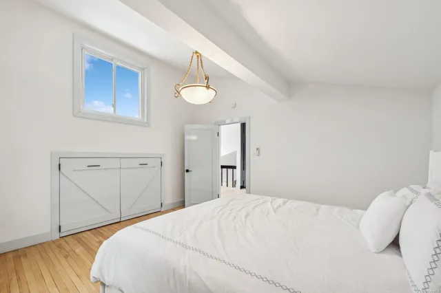 a bedroom with a bed and a cabinets