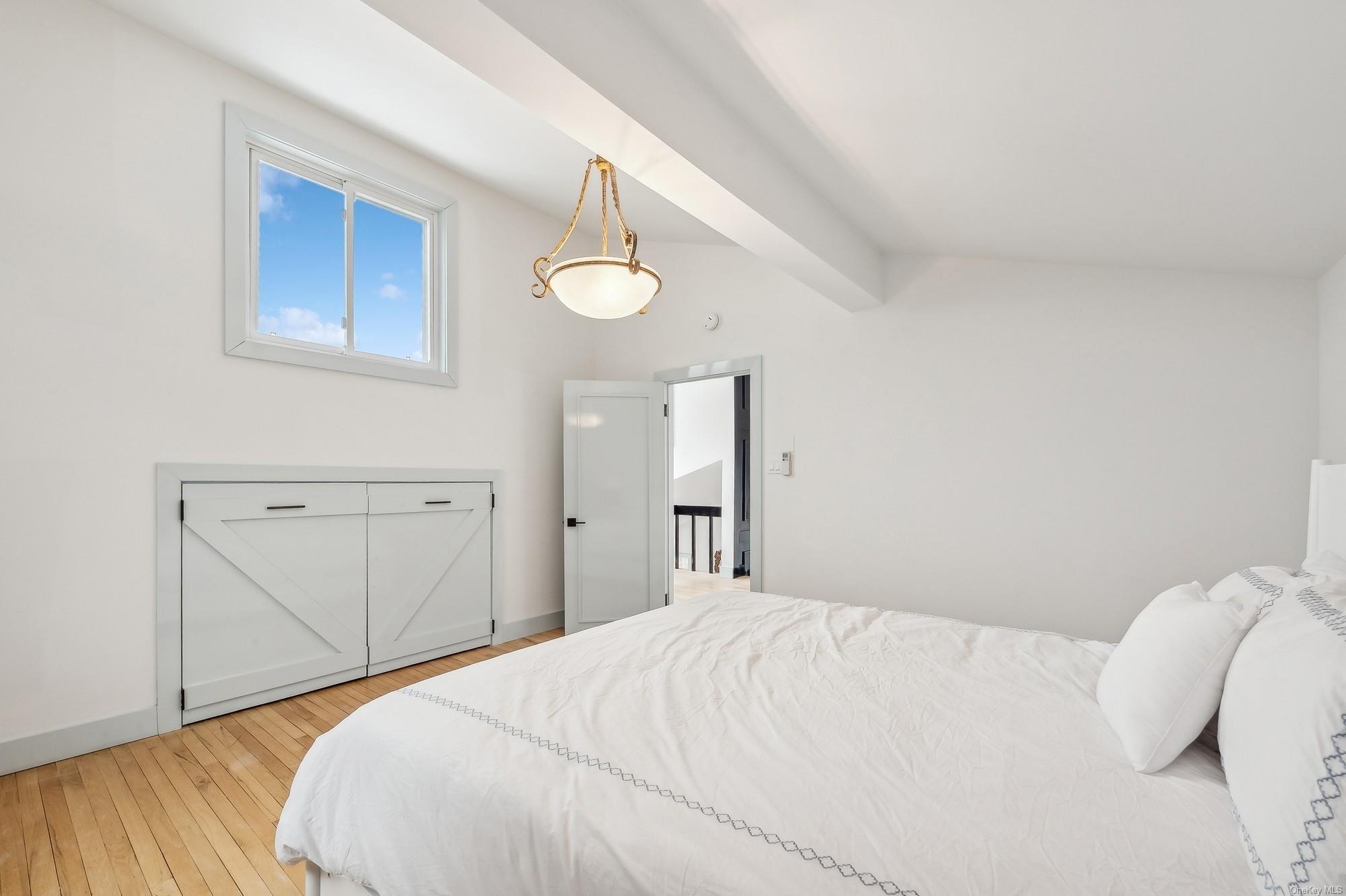 8 Big Reed Path Montauk, NY 11954 - Photo 37 of 39 a bedroom with a bed and a cabinets