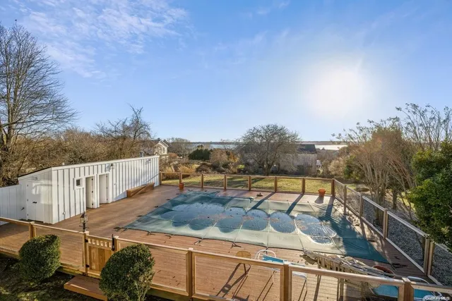 a view of a terrace with couches and sky view