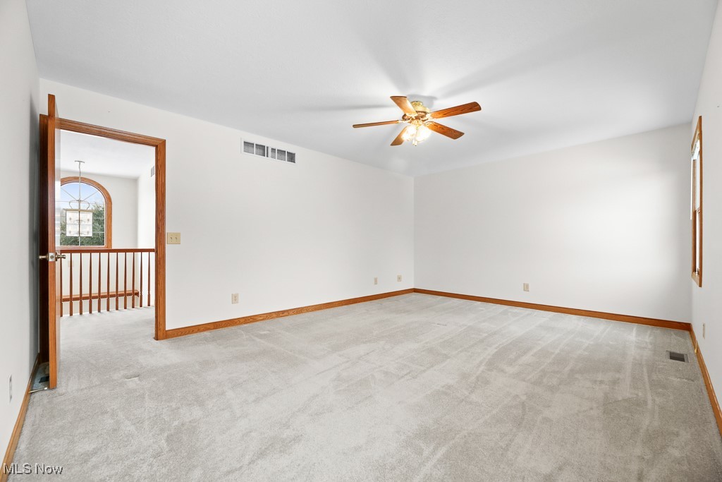 4808 Sherman Road Kent, OH 44240 - Photo 36 of 50 Empty room featuring light carpet and ceiling fan