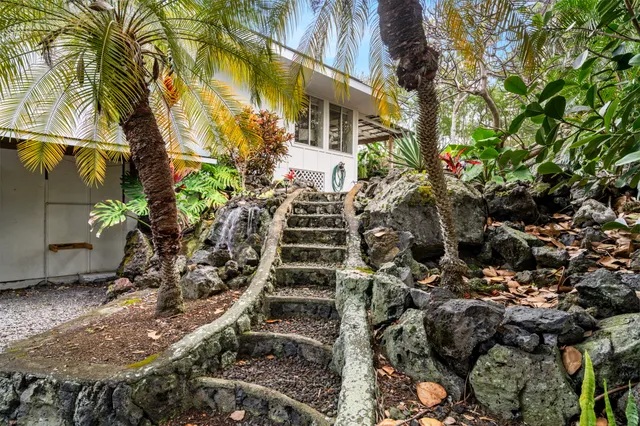 a view of a house with a tree
