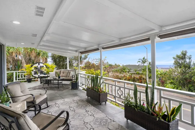 a view of a chairs and tables in the balcony