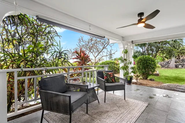 a outdoor living space with furniture and a potted plant