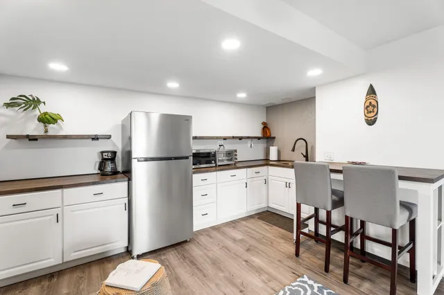 a kitchen with a sink stainless steel appliances and cabinets