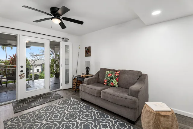a living room with furniture and a rug