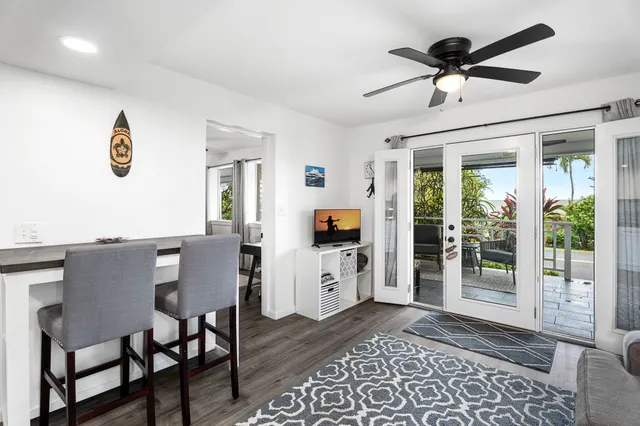 a workspace with wooden floor and a window