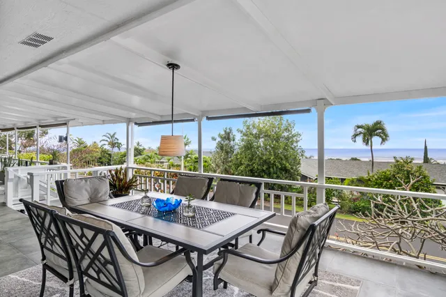 a view of an outdoor dining space with furniture