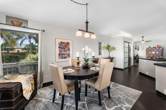 a dining room with furniture and window