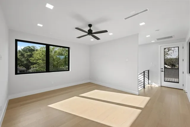 a view of a livingroom with furniture and a ceiling fan