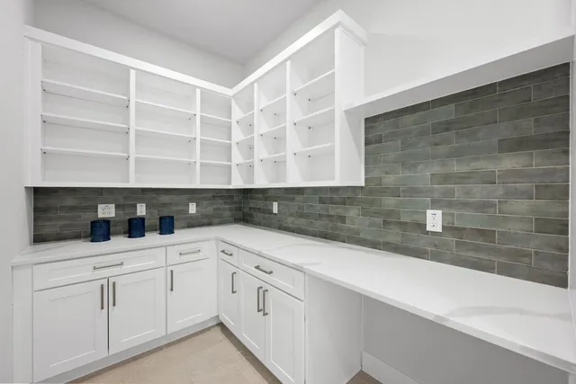 a kitchen with a sink and cabinets