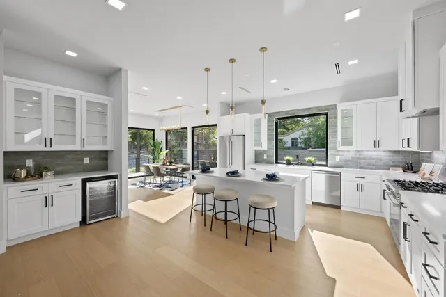 a kitchen with lots of counter top space and stainless steel appliances