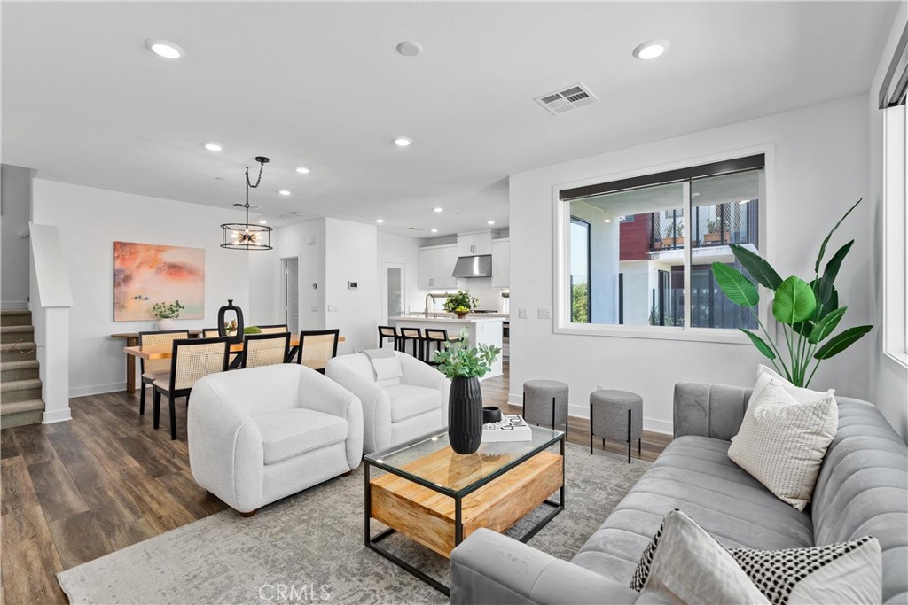 303 Lodestar Tustin, CA 92782 - Photo 13 of 37 a living room with furniture and wooden floor
