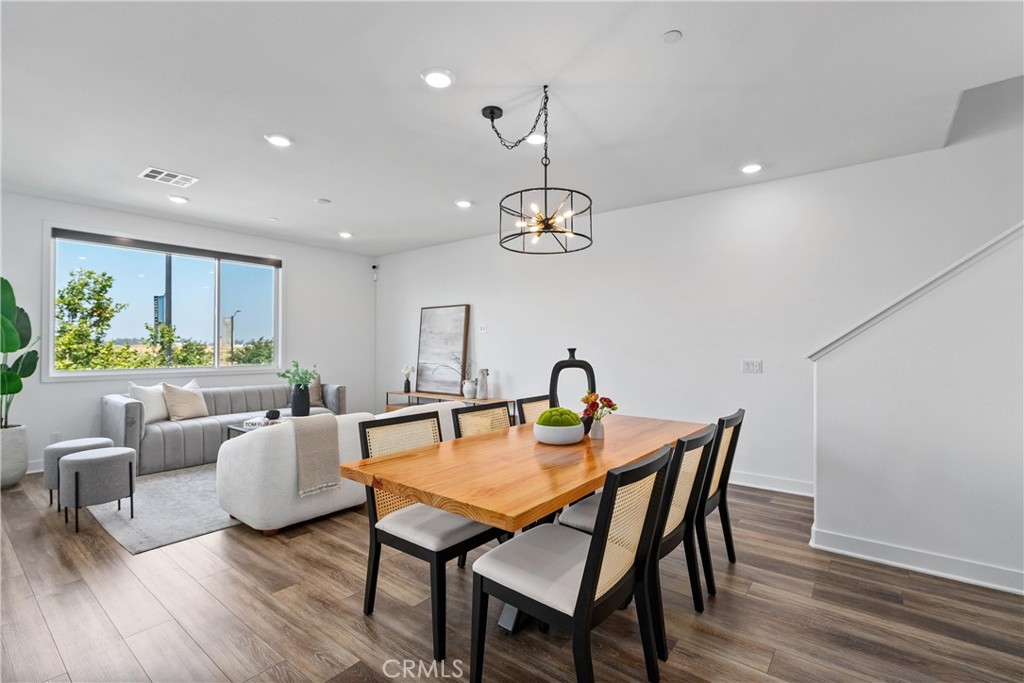 303 Lodestar Tustin, CA 92782 - Photo 15 of 37 a view of a dining room with furniture and wooden floor