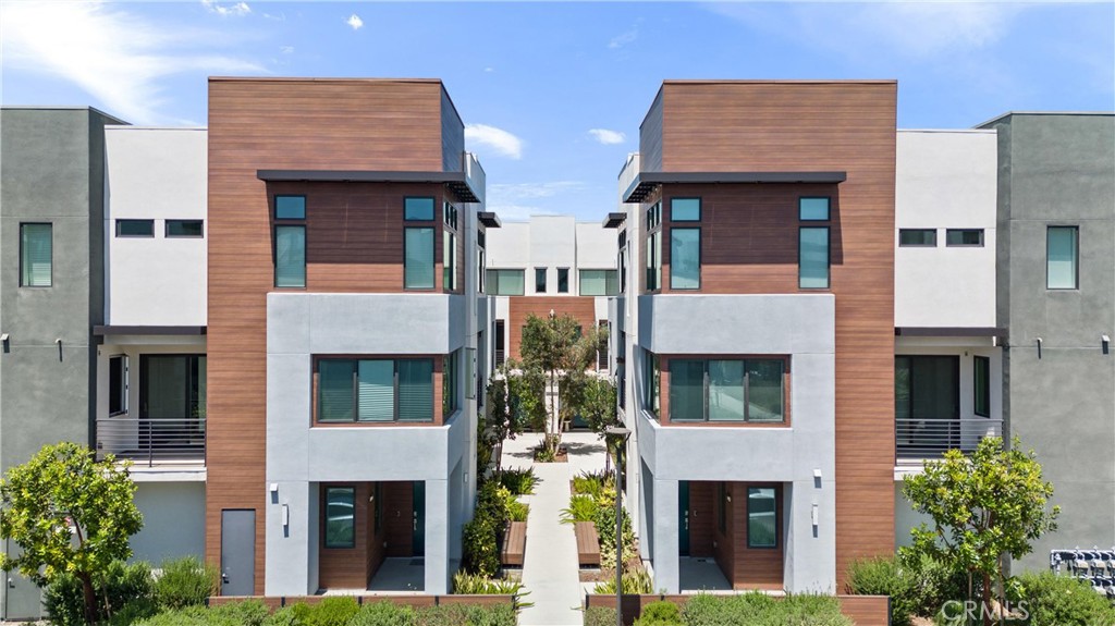 303 Lodestar Tustin, CA 92782 - Photo 2 of 37 a front view of multi story residential apartment building