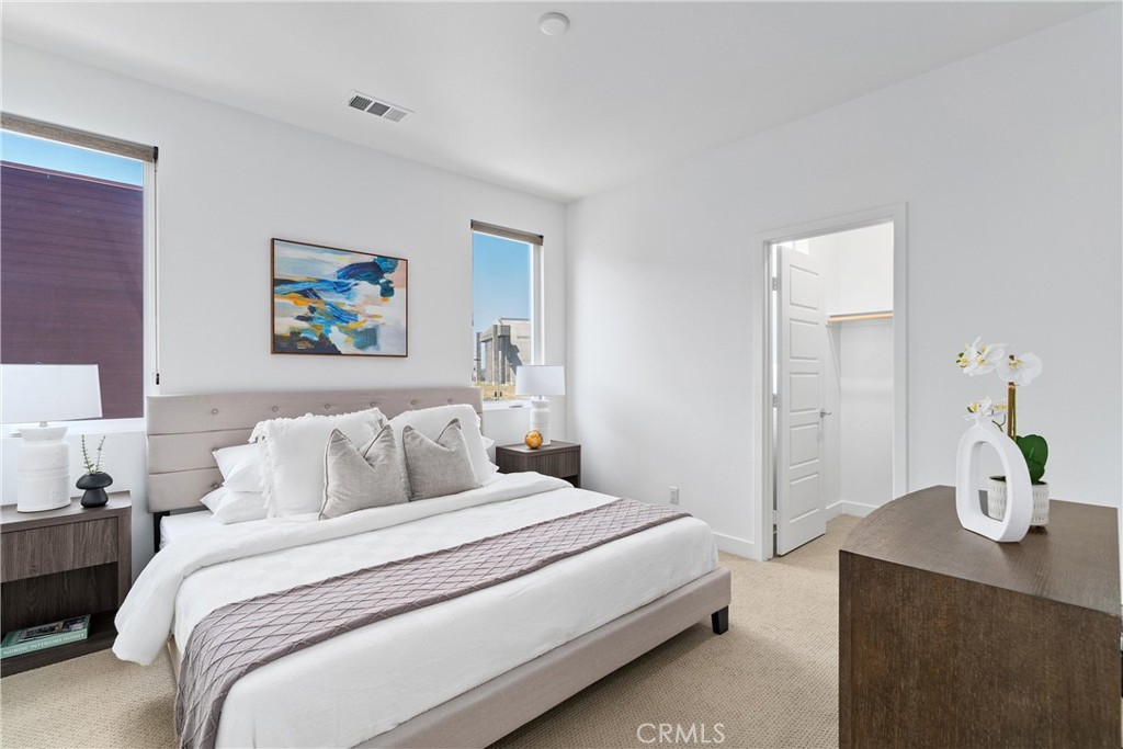 303 Lodestar Tustin, CA 92782 - Photo 24 of 37 a bedroom with bed and wall painting