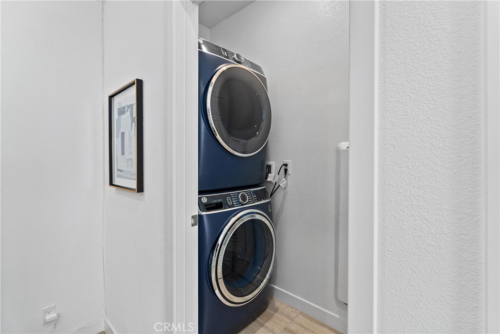 303 Lodestar Tustin, CA 92782 - Photo 27 of 37 a utility room with dryer and washer