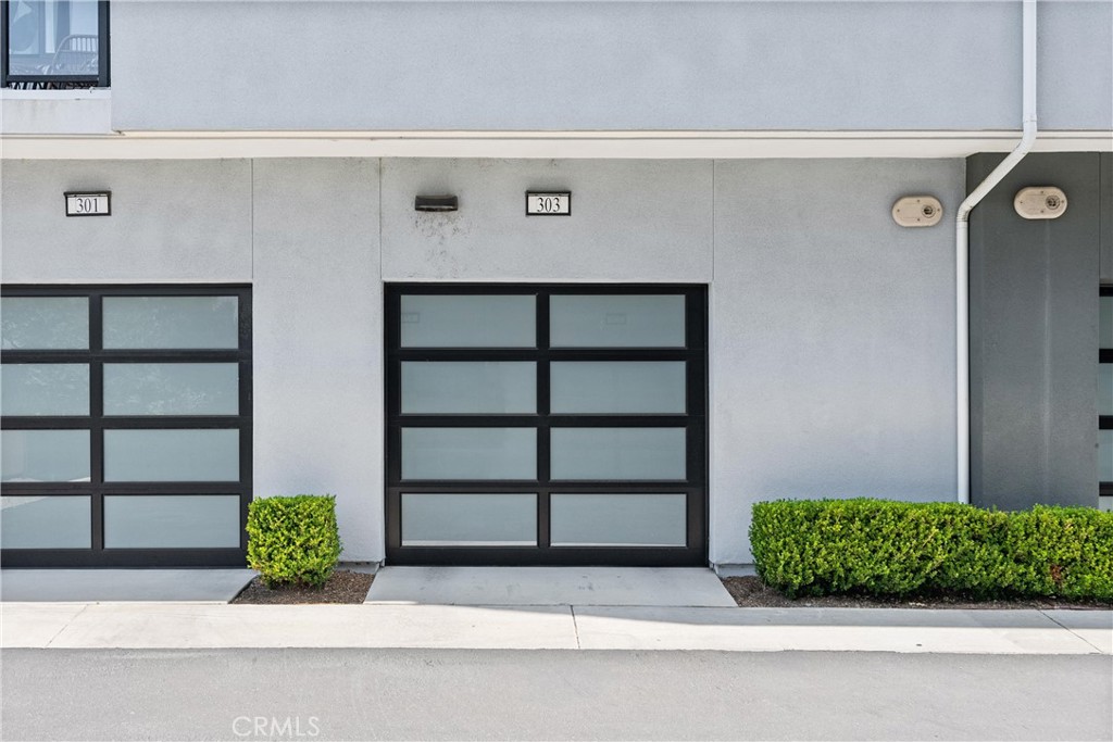 303 Lodestar Tustin, CA 92782 - Photo 28 of 37 a front view of a house with a garden
