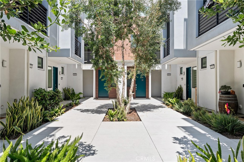 303 Lodestar Tustin, CA 92782 - Photo 3 of 37 a front view of a house with garden