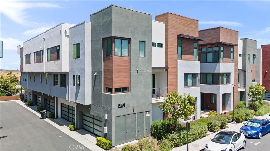 303 Lodestar Tustin, CA 92782 - Photo 31 of 37 a view of a large building with many windows