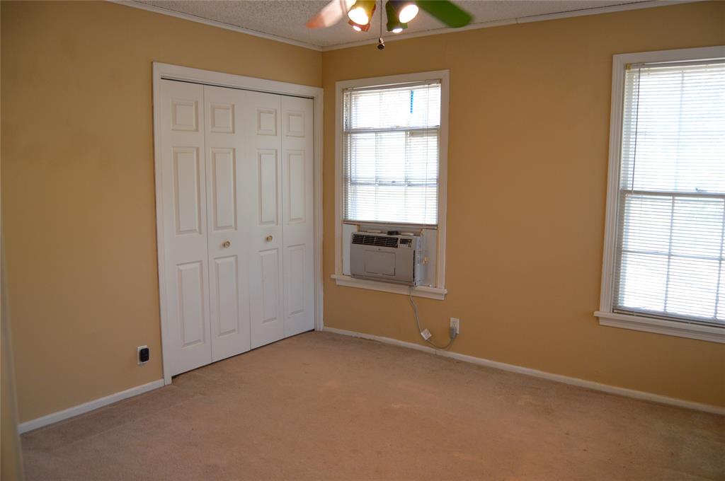 4120 Interstate 30 Campbell, TX 75422 - Photo 19 of 36 an empty room with windows and closet