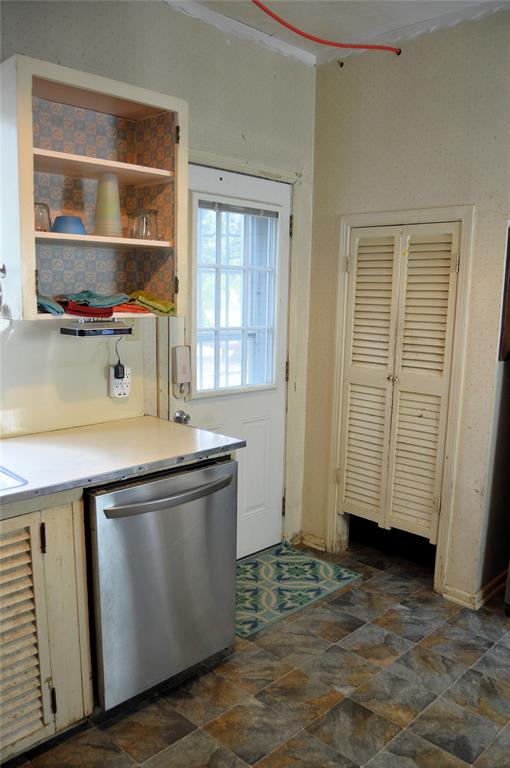 4120 Interstate 30 Campbell, TX 75422 - Photo 23 of 36 an empty room with wooden floor and cabinet